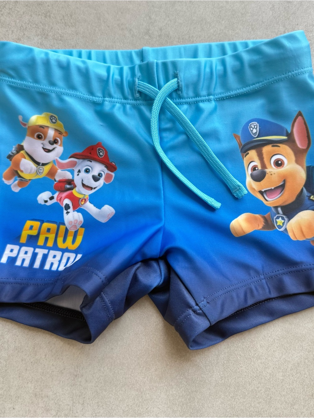 Paw patrol swimwear trunks shorts sz 3/4T Blue print logo stretch drawstring nwt